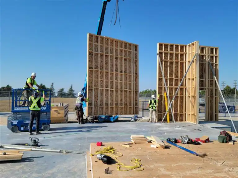Nuframe team craning pre fabricated walls at YVR commercial project in Richmond BC.
